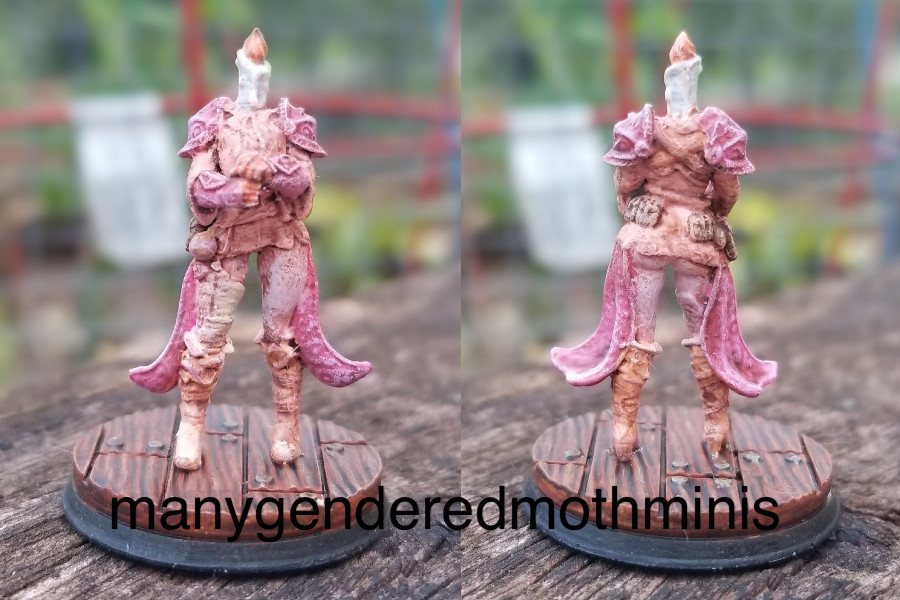 A knight in pastel pink armor and a candle for a head.